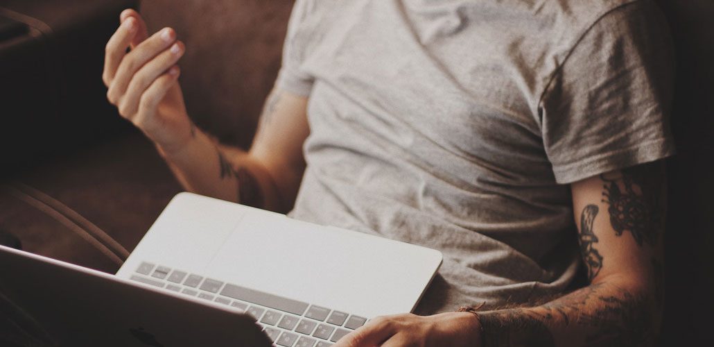 man sitting with laptop