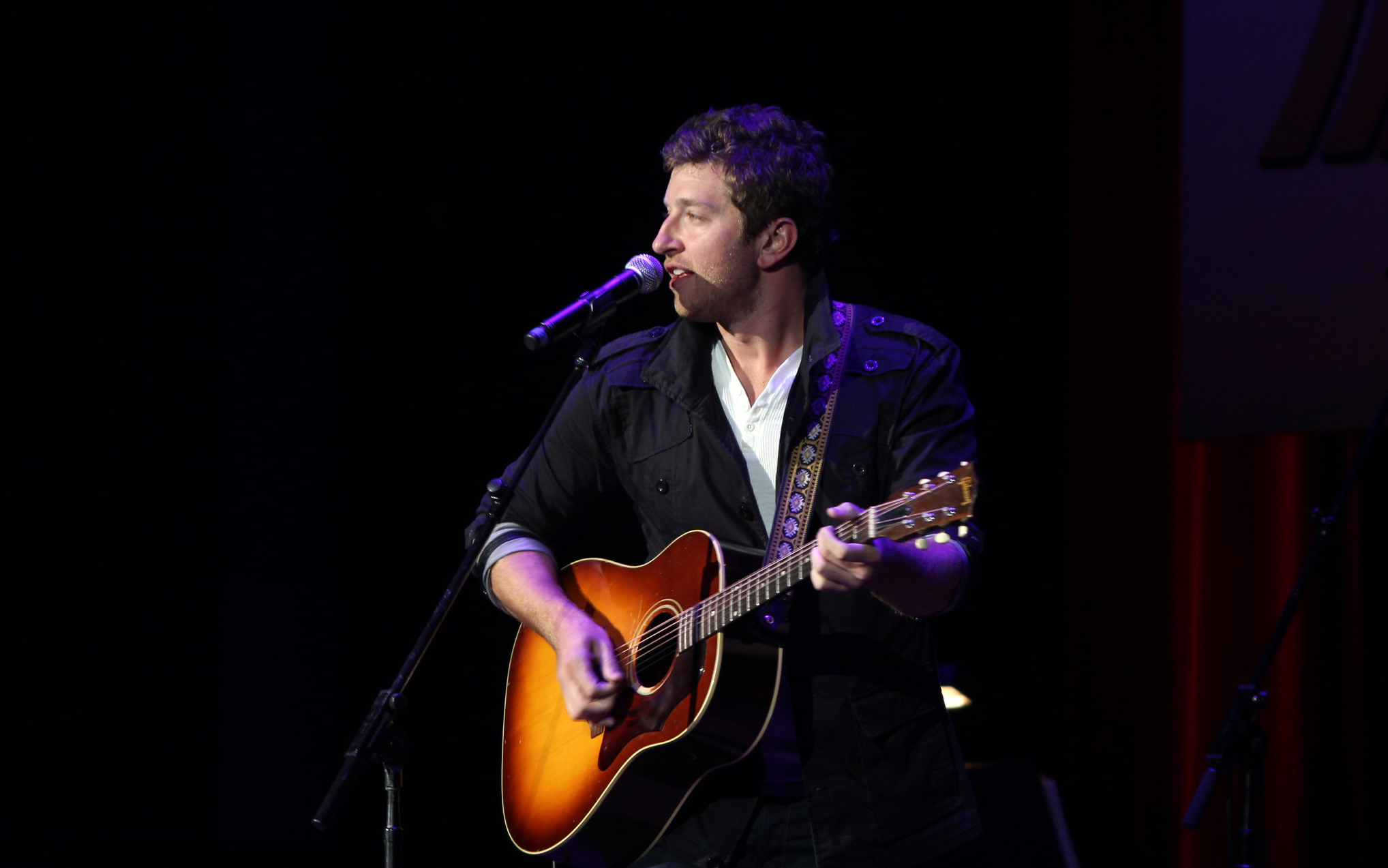 Brett Eldredge performing with guitar