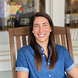 Photo of Christina Rogers sitting in a chair