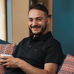 Photo of Hazim Al-Faouri holding a coffee cup