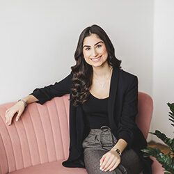 Photo of Jordie Yule Sitting on a Pink Couch