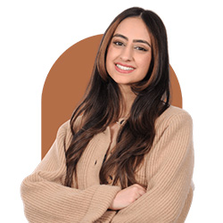 A headshot of Mahnoor Zulfiqar with a burnt orange rounded graphic behind