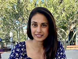 Woman in front of trees